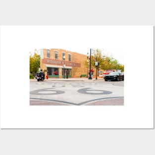 Route 66 sign on road in Winslow Arizona Posters and Art